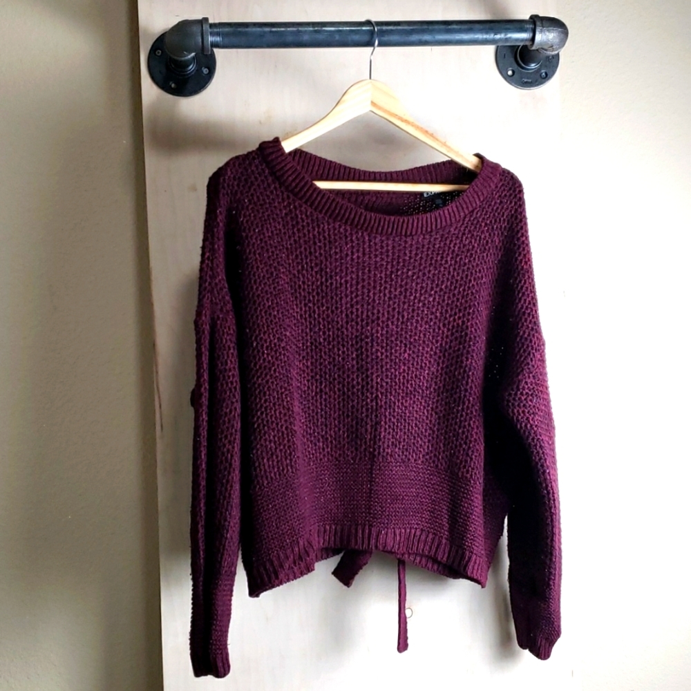 Cable knit sweater with tied back